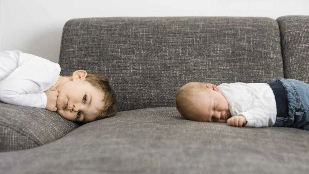 Children relaxing on freshly cleaned upholstery